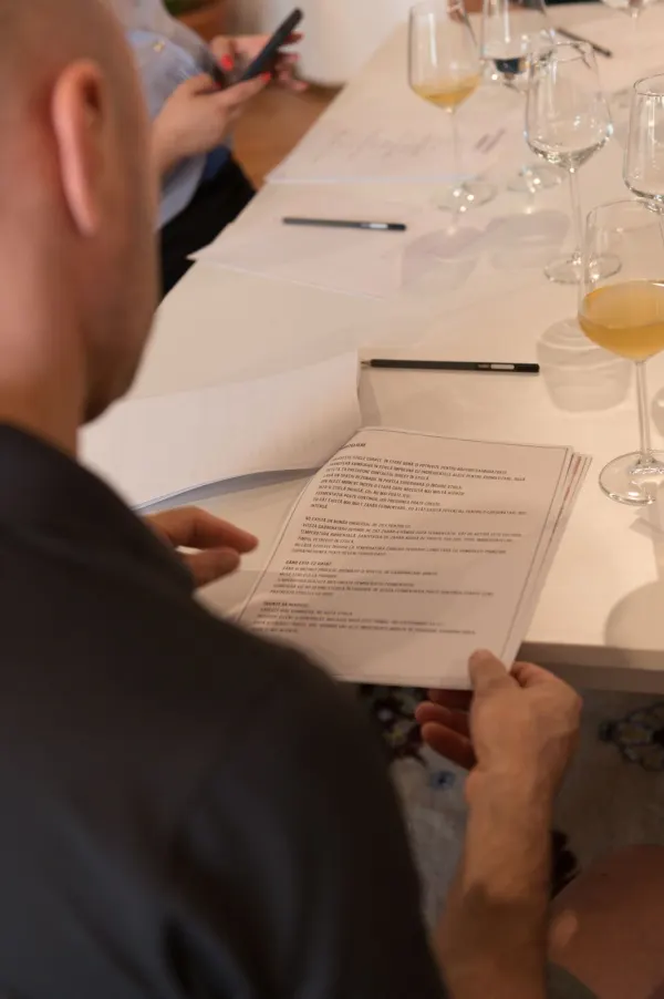 A participant reading the bottling and second fermentation page of the workshop guide